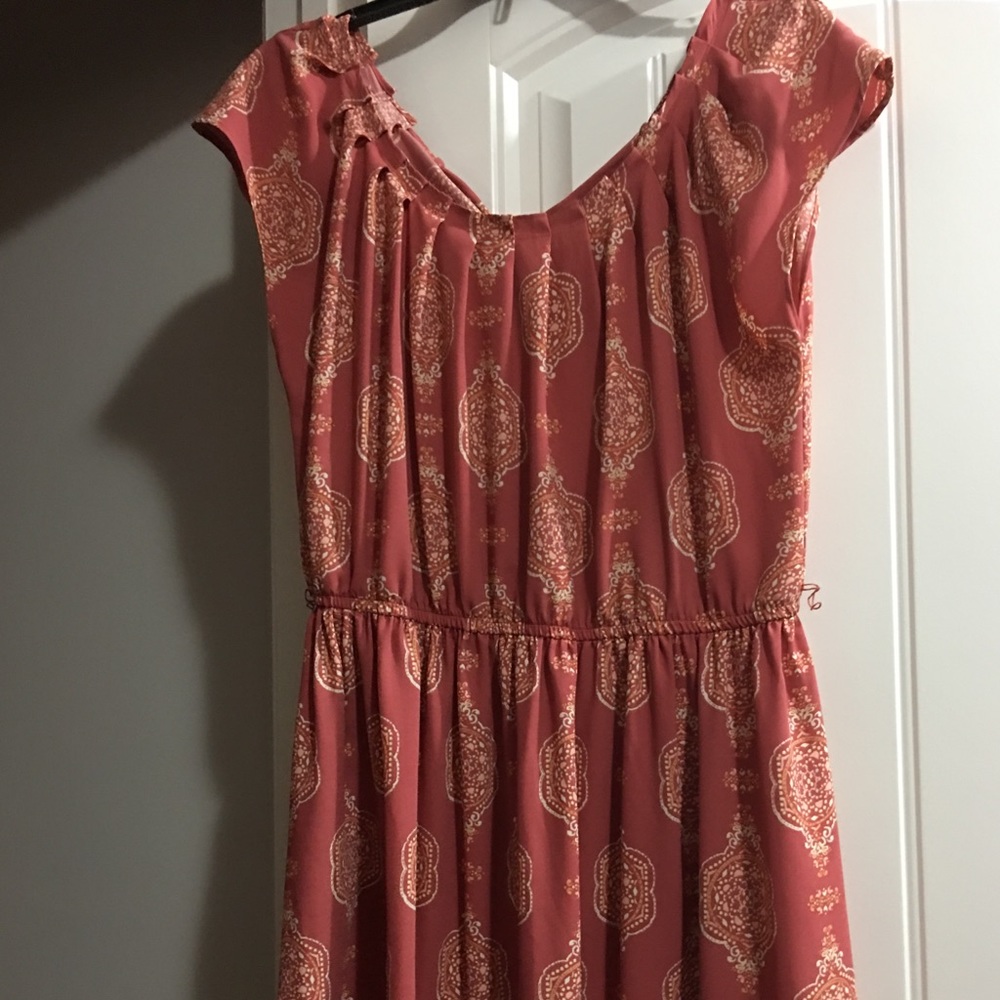 Tan dress. Above the knee. 3rd pic shows the back.